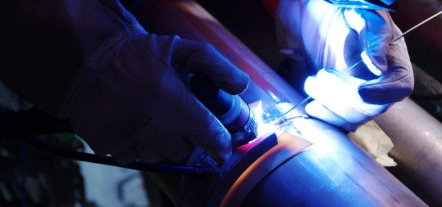 image of welder welding