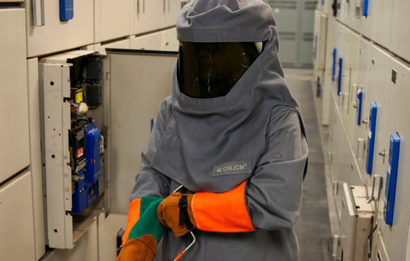 fully protected equipment manager in hazmat suit